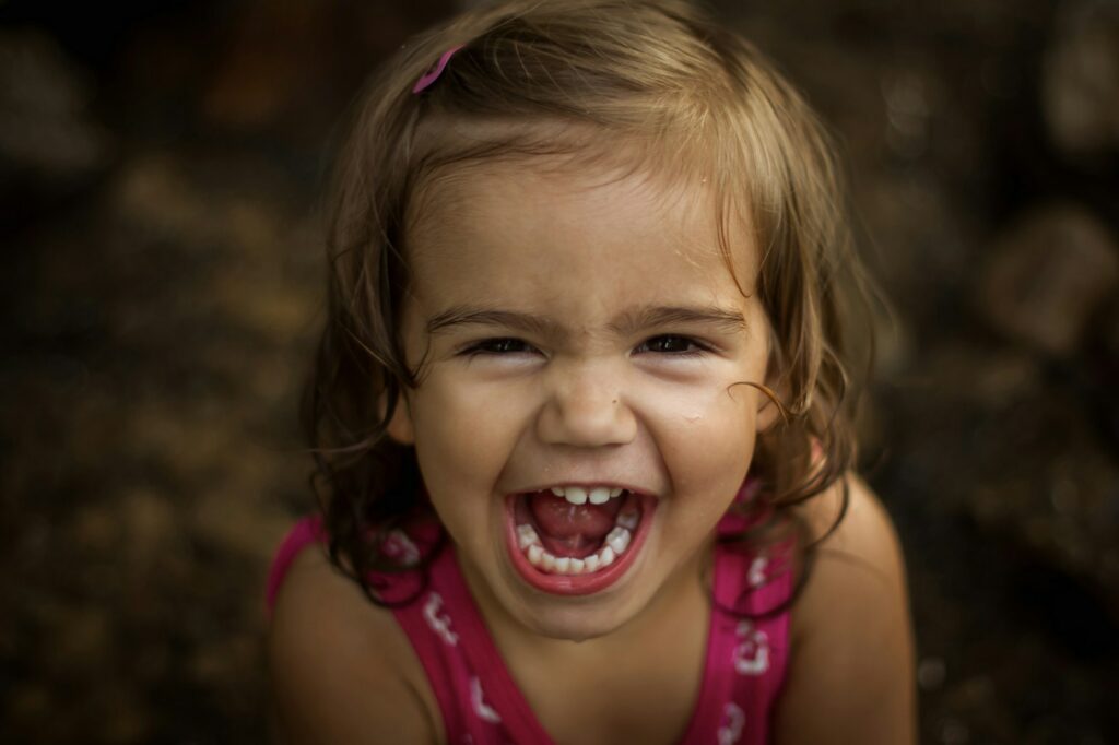 Happy toddler in a creek